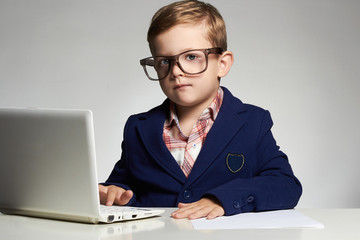 Young businessman using a laptop © eugenepartyzan