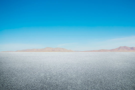 Side View Asphalt Road With Blue Sky .