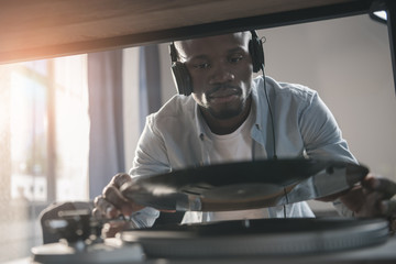 Man playing vinyl record