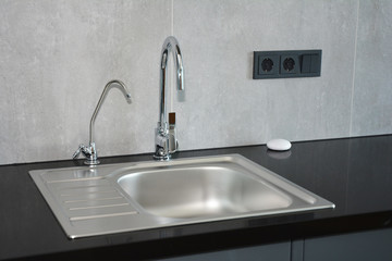 Modern kitchen. Faucet and sink
