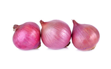 whole unpeeled shallot on white background