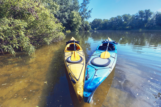 A summer walk along the river on kayaks on a sunny day.
