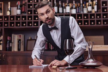 sommelier tasting wine