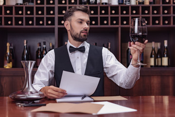sommelier tasting wine