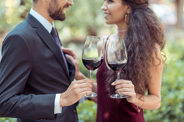 coupe with red wine in garden