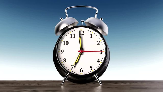 vintage black alarm clock on blue background. Time concept.