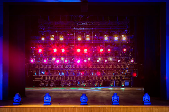 Spotlights with colored filters at the theater or concert hall. Professional lighting equipment.