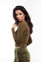 Attractive young brunette woman model wearing stylish army green one shoulder design t-shirt