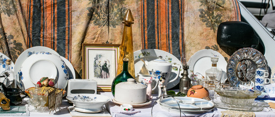 retro display of household things and dishes at garage sale