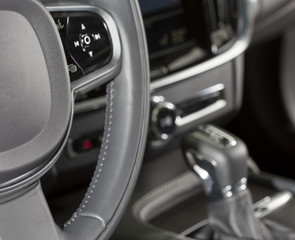 Interior and dashboard instruments of a modern luxury car.