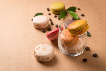 Colorful macaroons. Sweet macarons on retro background .