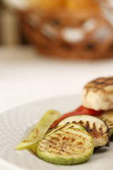 Grilled vegetables arranged on a plate, Traditional dish in elegant setting, Selective focus with soft light