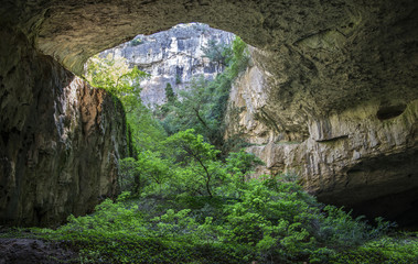 huge cave with holes above