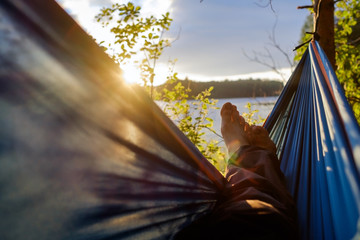 Man relaxing in the hammock.