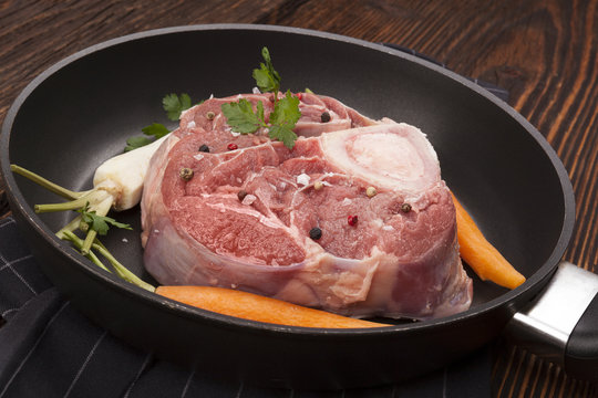 Raw ossobuco meat in pan