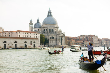 Venice, Italy - July 21, 2017 : Gondola on canal in Venice, Italy
