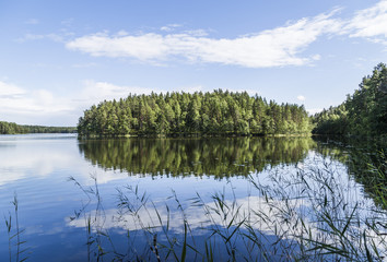 Fototapeta premium Beautiful sunny summer day next to lake in Finland