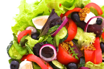 salad from fresh vegetables in a plate on a table, selective focus