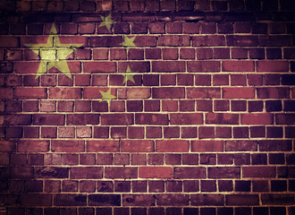 Grunge China flag on a brick wall