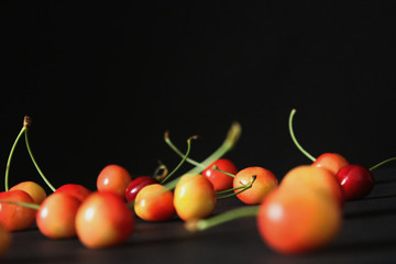 Cherries isolated in black background 