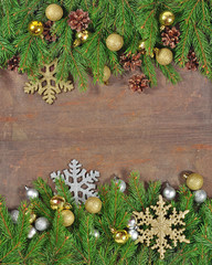 Golden Christmas decorations and spruce branch and cones