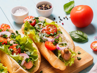 homemade hotdogs with chicken sausages and fresh vegetables