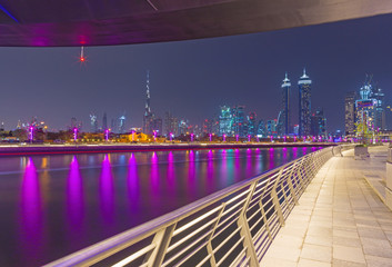 Dubai - The evening skyline with the bridge over the new Canal and Downtown.