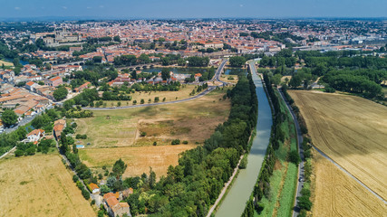 Aerial top view of Beziers town, river and bridges from above, South France
