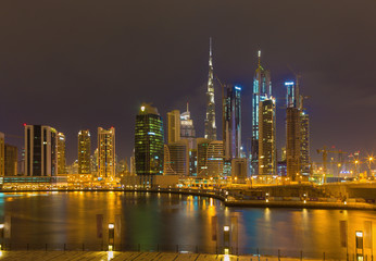 DUBAI, UAE - MARCH 24, 2017: The evening skyline over the Canal and Downtown.