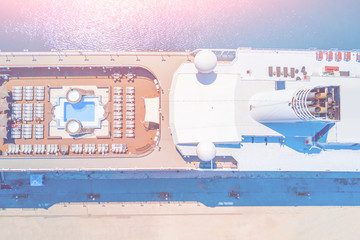 Naklejka premium Part of a large cruise ship at the pier in the sunlight, top view