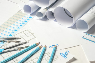 Workplace of architect - rolls and plans.