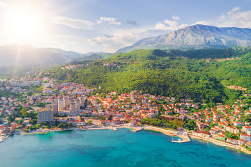 Beautiful city in the mountains near the sea in the sunlight - obrazy, fototapety, plakaty