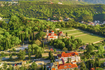 View from above to old European resort town with a monastery