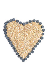 Seamless pattern with blueberry and dried grapefruit. Organic raw rolled oats in heart shape with blueberries on the white background.