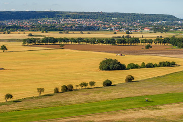 Obraz premium Landscape view with fields and a town on a mountain in Sweden
