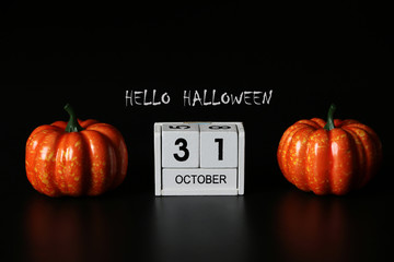 HELLO Halloween text and 31 October Wooden calendar and pumpkin for Halloween day .minimal...