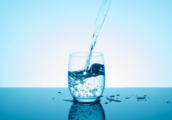 Creative splashing water in the glass