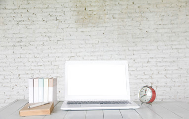 Stock photo :.Front view of laptop on wood table in old office in vintage style