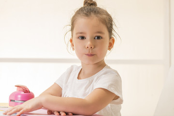 Beautiful little girl sitting at the desk waiting. Learn Study Education School Knowledge Concept...