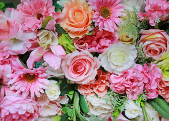 Artificial bouquet flowers background.