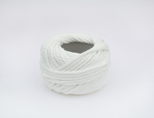 Roll of white yarn thread isolated on white background.