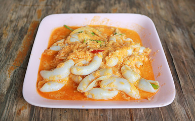 Stir fried fresh squid with yoke eggs ,onion and chili.