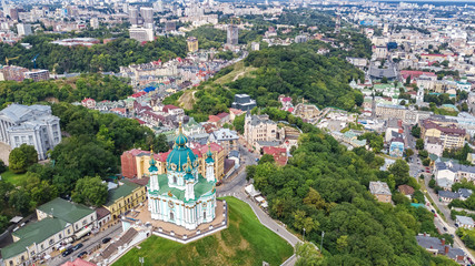 Fototapeta premium Aerial top view of Saint Andrew's church and Andreevska street from above, Podol district, city of Kiev (Kyiv), Ukraine 