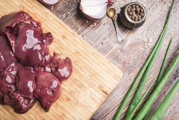 Chicken liver on a wooden cutting board