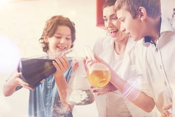 Positive delighted boys mixing reagents