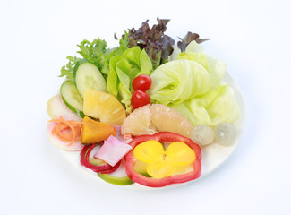 Fresh vegetable salad isolated on white.