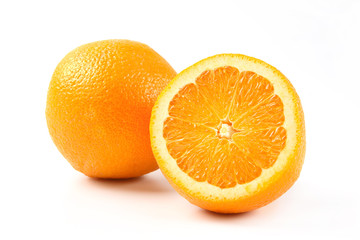 Orange fruit with slice on white background.