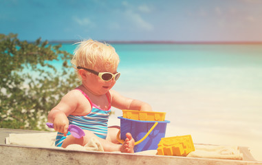 cute little girl play on beach