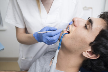Dentist working with patient.