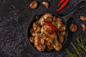 Fried chicken legs with rosemary, garlic and chilli.